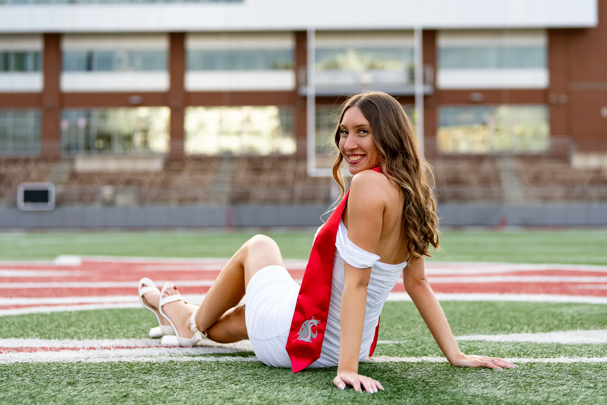Graduate celebrating in cap and gown at Washington State University in Pullman, WA — photo 1