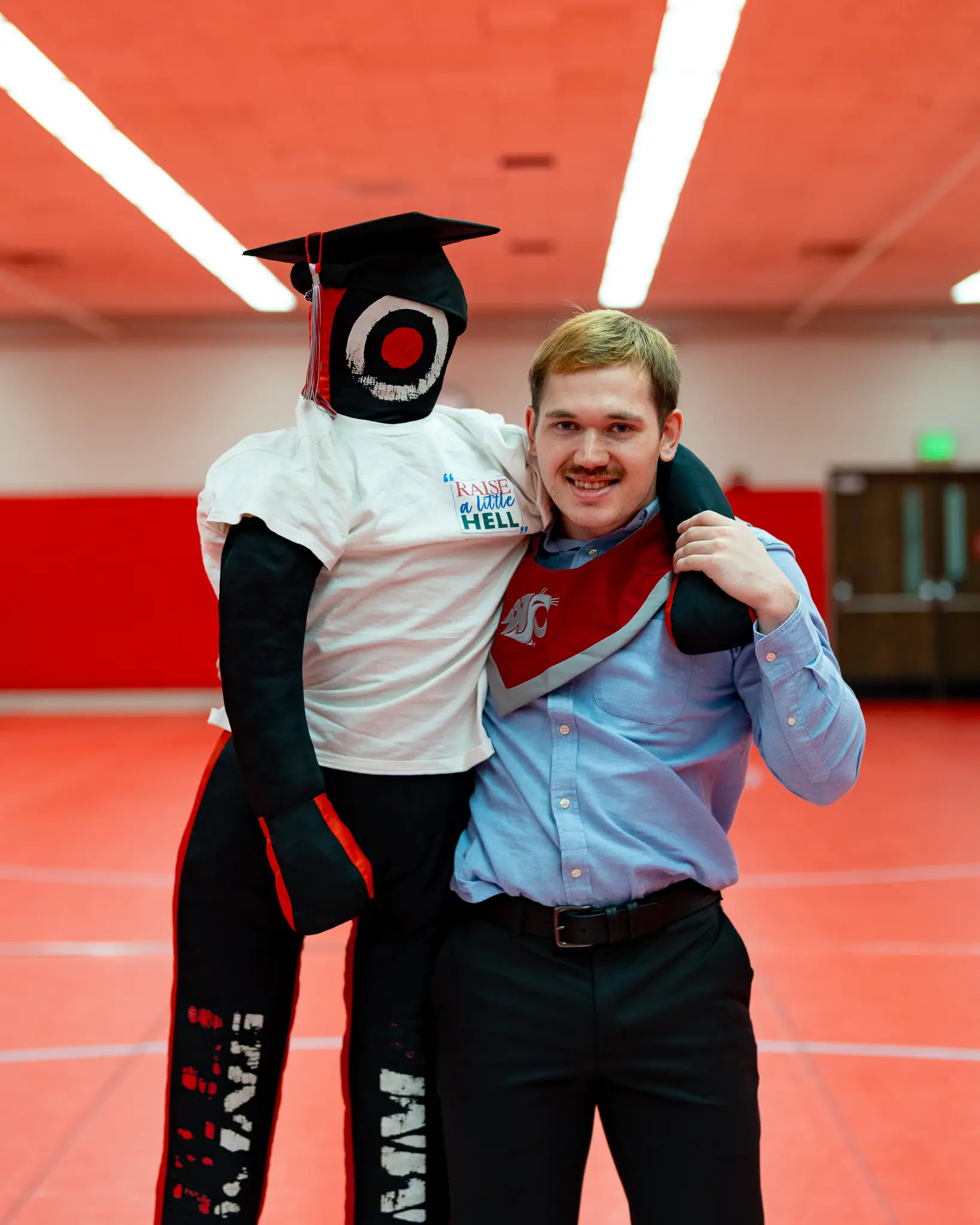 Graduate celebrating in cap and gown at Washington State University in Pullman, WA — photo 2