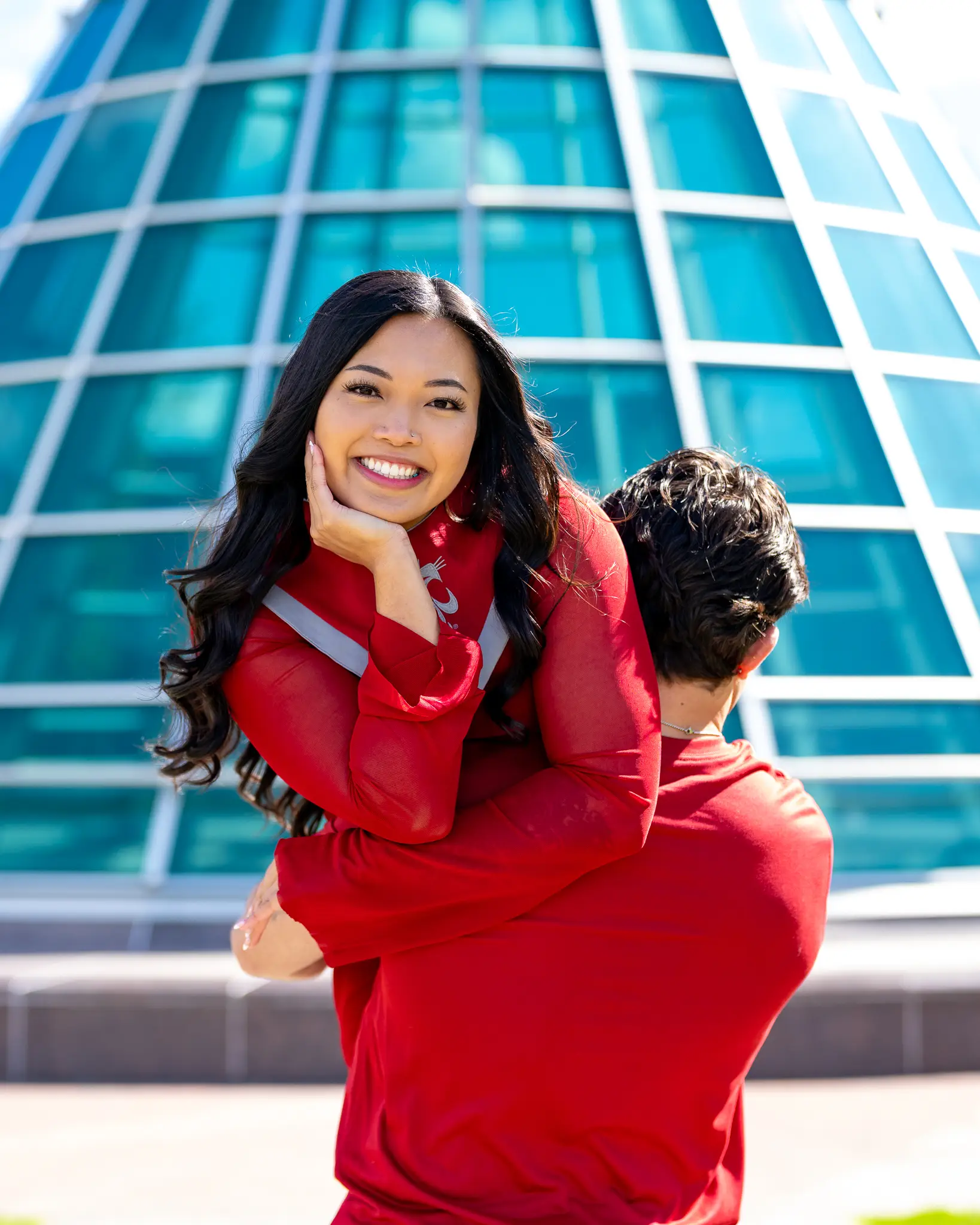 Graduate celebrating in cap and gown at Washington State University in Pullman, WA — photo 3