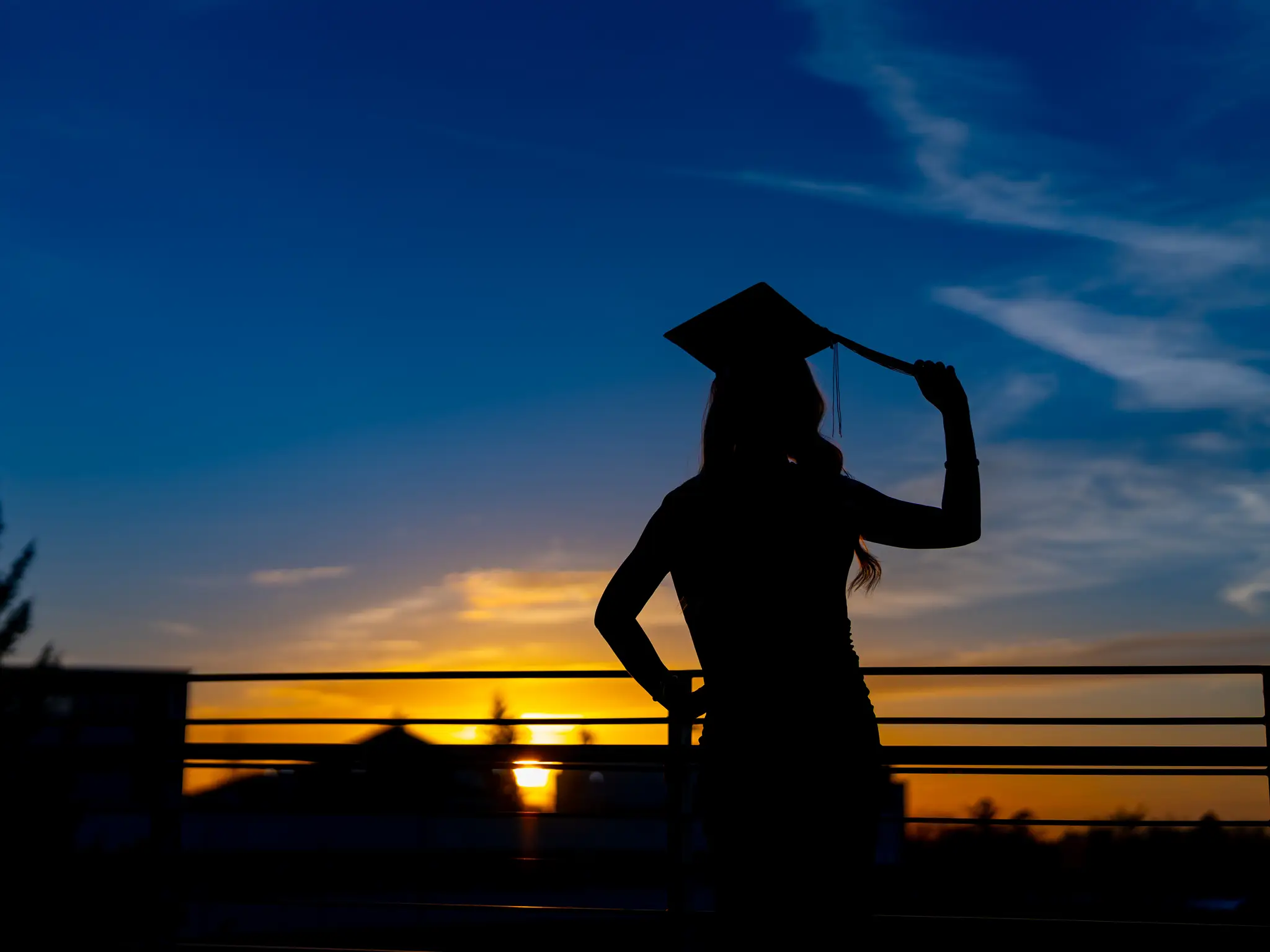 Graduate celebrating in cap and gown at Washington State University in Pullman, WA — photo 5