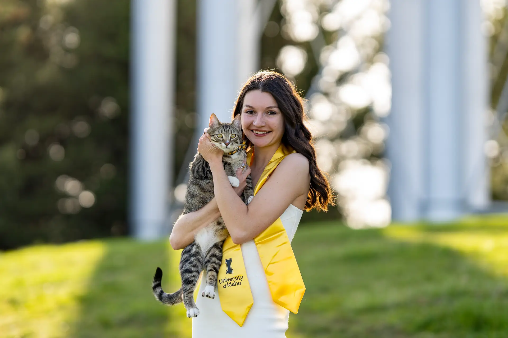 Graduate posing with their pet for graduation photos in Pullman, WA — photo 2